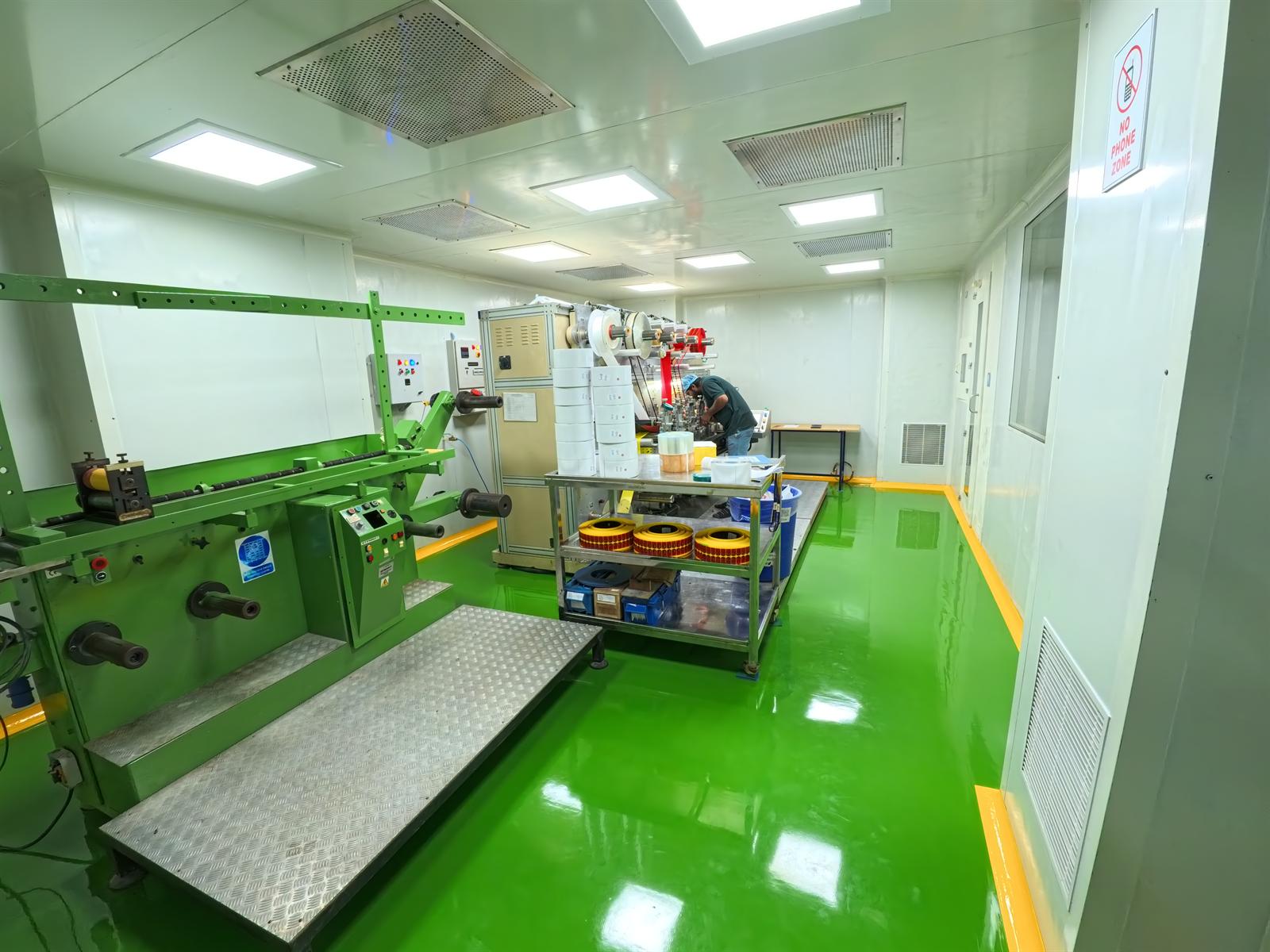 Industrial workspace with green epoxy flooring